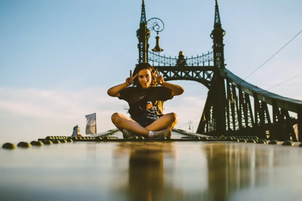 Sitting Pose Reference: Ressources For Your Next Inspiring Creation 2024 3 A young Tourist on a bridge as a Sitting Pose Reference
