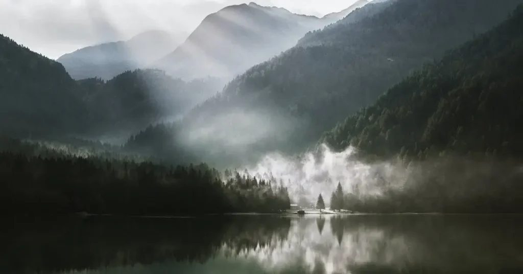 Landscape Drawing Ideas: Tips and Inspiration for Beginners 2024 5 a sea with forest mountains as Landscape Drawing Ideas