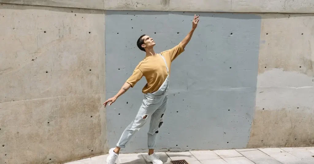 Dancer Drawing Reference: Dance With Ease To Your Next Best Dance Drawing 2024 107 a man in front of a concrete wall as a Dancer Drawing Reference