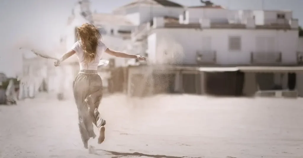Female Pose Reference: A Guide to Capturing Feminine Forms 2024 5 woman running through sand as a female pose reference