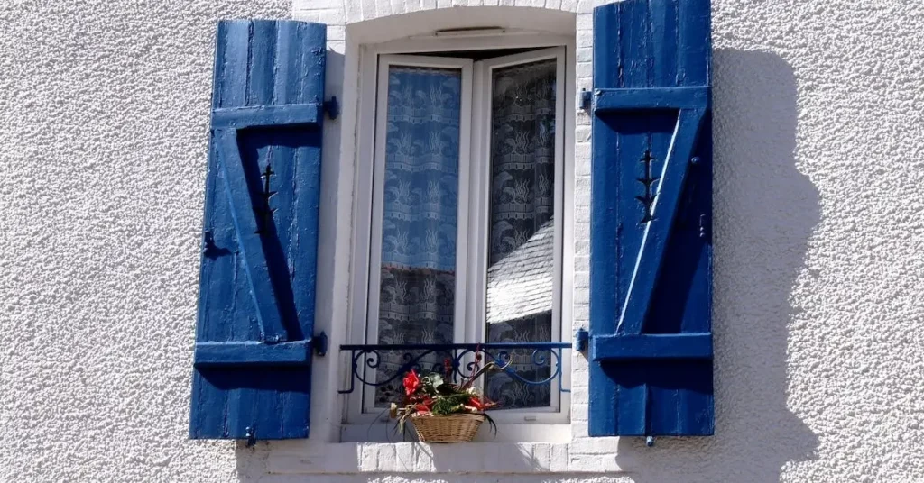 Blue Things to Draw: Ideas for Artistic Inspiration 2024 7 a windows with blue shutters as blue things to draw