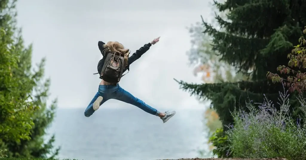 Female Pose Reference: A Guide to Capturing Feminine Forms 2024 4 woman jumping as a female pose reference
