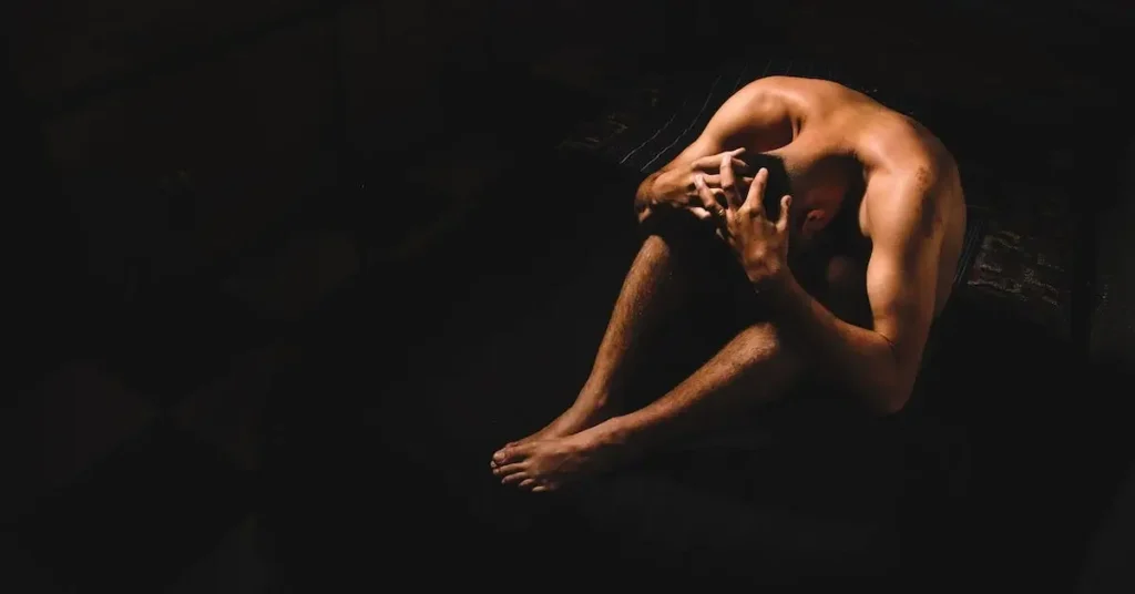 Male Pose Reference: A Guide to Dynamic Male Sketches 2025 122 nude man sitting on the floor as a Male Pose Reference