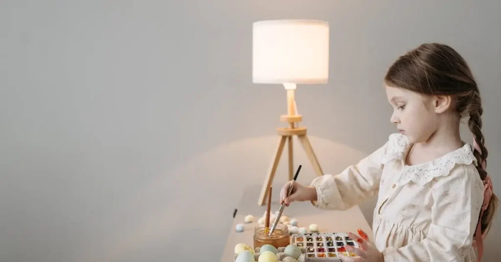 100+ Easter Drawing Ideas: Hop into new Egg-citing Drawing Ideas 2025 8 a girl painting eggs as easter drawing ideas