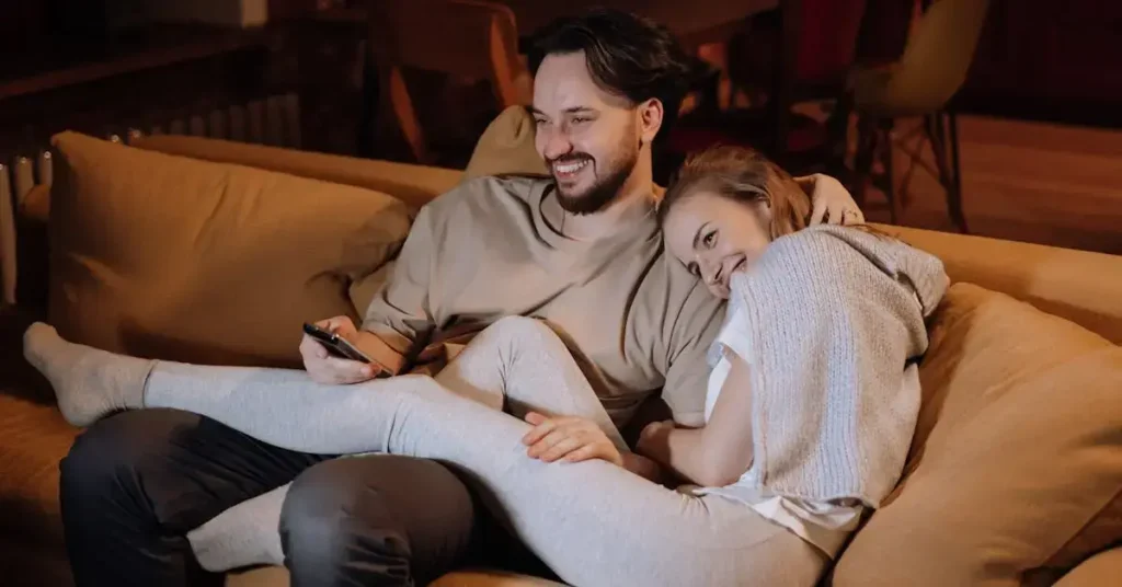 100 Couple Drawing Ideas: Heartfelt Inspirations to Draw 2024 14 a couple snuggling on the couch as couple drawing ideas
